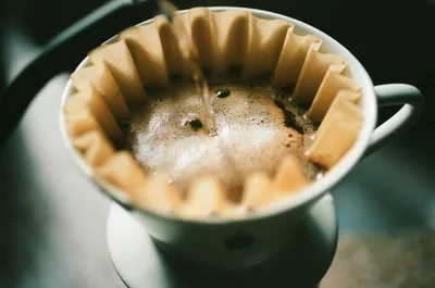 pour over coffee brewing in ceramic dripper