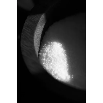 wooden spoon with coarse salt crystals