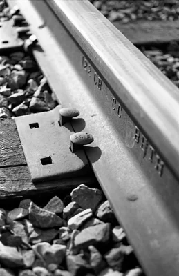 railroad track junction on wooden ties