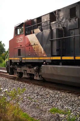 diesel locomotive on railroad tracks number 2253