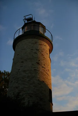 old brick lighthouse tower at golden hour