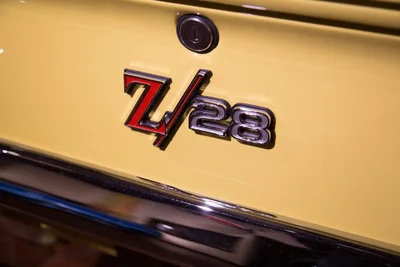 z28 emblem on yellow muscle car trunk