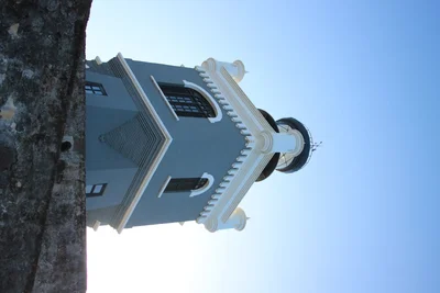 white church tower against clear blue sky